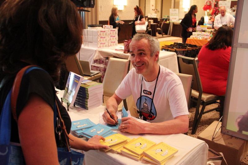 Pete the Vet signing books at BlogPaws: good pet advice for only a few dollars